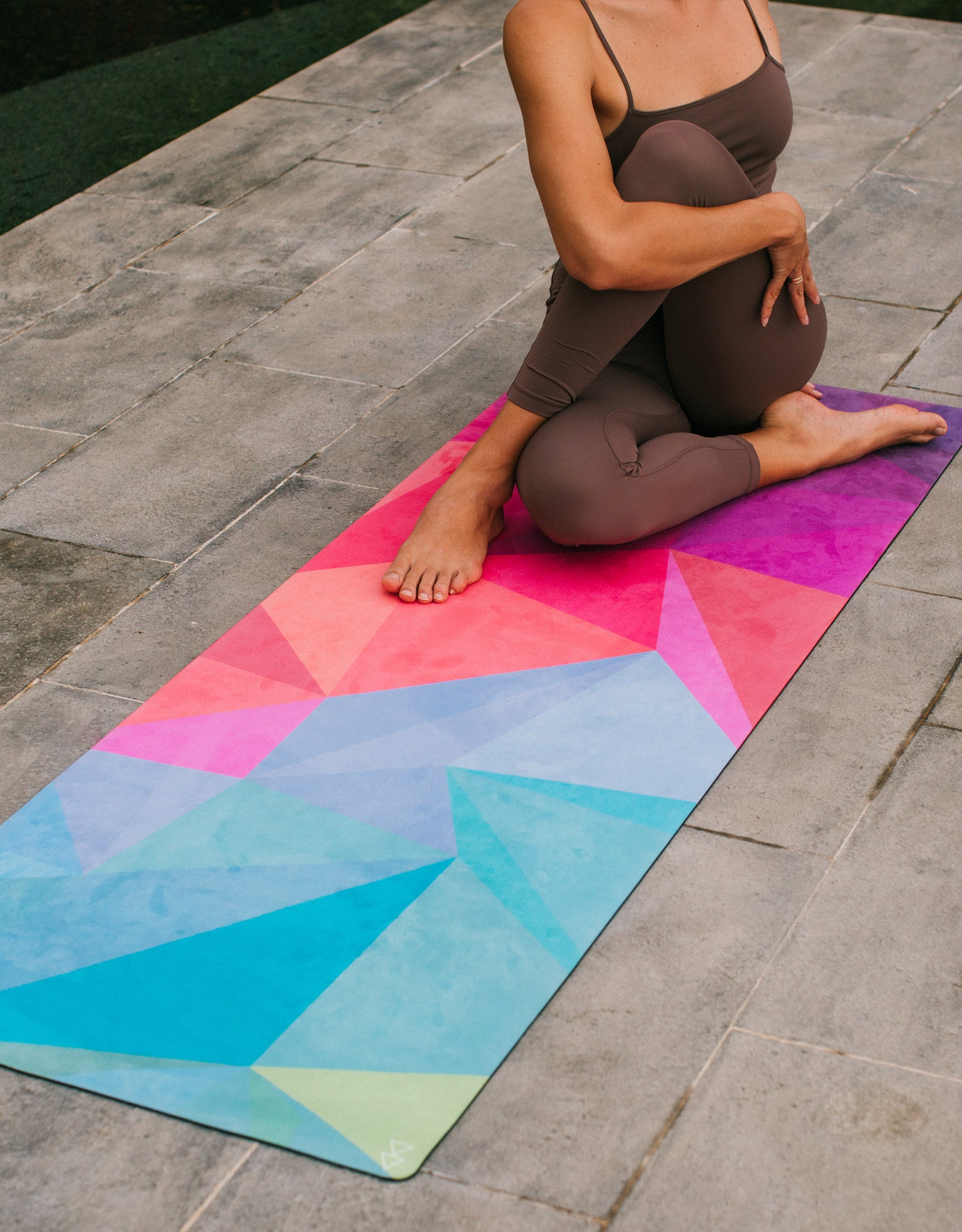 A woman doing yoga on yoga mat
